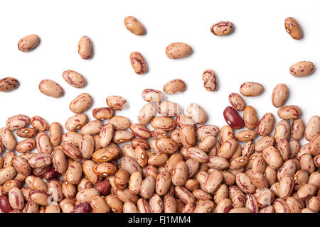 Raw Pinto beans scattered on white background Stock Photo