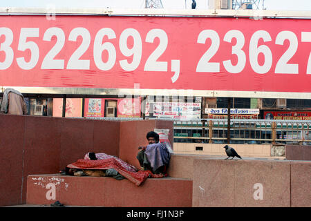 Homeless man Beggar  in a street of Delhi, Pahr Ganj district, India Stock Photo