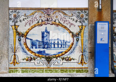 Ceramic tiles or azulejos on wall of railway station and announcements speaker, Caminha, Minho Province, northern Portugal Stock Photo