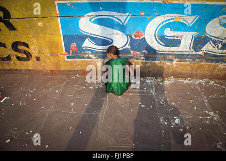 Street kid /beggar , shot from behind, in Kolkata, India Stock Photo