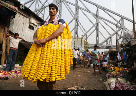 Flower seller at the Kolkata Mullick ghat flower market , India Stock Photo