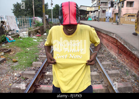Man wearing nice t shirt with writings in the streets of Kolkata Stock Photo