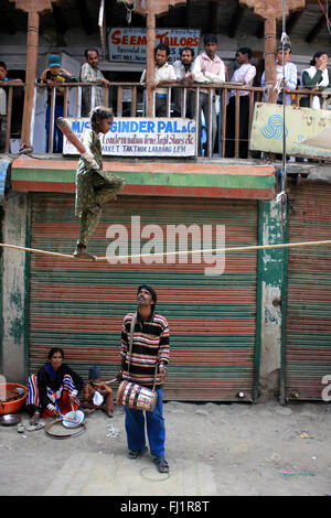 Acrobats (Seasonal workers) playing in Leh , Ladakh, India Stock Photo