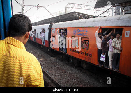 People passengers inside suburban train in Mumbai Bombay, India Stock Photo