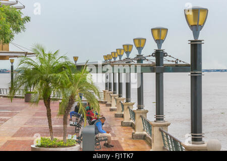 GUAYAQUIL, ECUADOR, OCTOBER - 2015 - Group of people at the modern Puerto Santa Ana boardwalk in Guayaquil, Ecuador Stock Photo