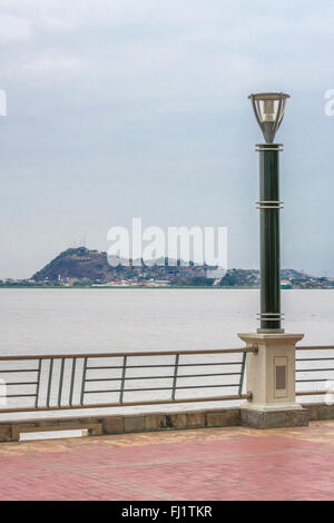 Guayas river and hill view at the boardwalk in Puerto Santa Ana in Guayquil, Ecuador. Stock Photo