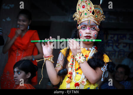 Hindu bou dresses as God Krishna in holy city Varanasi, India Stock Photo