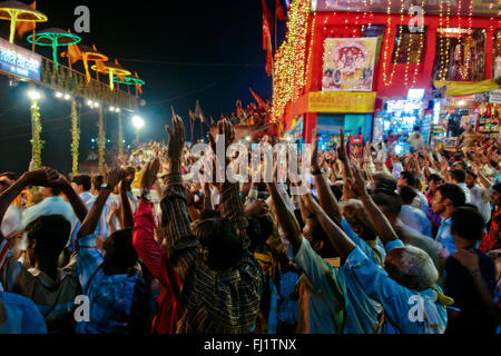 Crowd during ceremony at night on Dashashwamedh Ghat , Varanasi, India Stock Photo