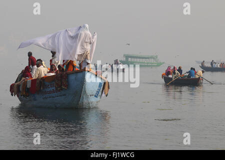 Hindu pilgrims on a boat on the ganges,  in holy city Varanasi, India Stock Photo