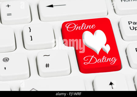 Online dating button on a white computer keyboard. Stock Photo