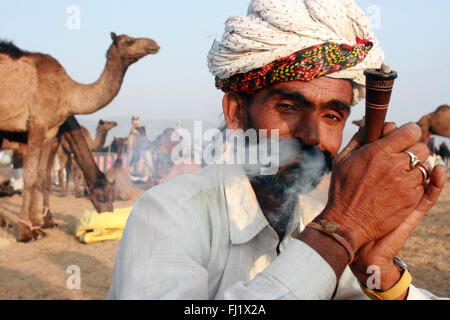 Portrait of Indian Rajasthan Rajasthani hindu man during Pushkar mela-  Pushkar camel fair in Rajasthan, India Stock Photo