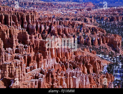 Winter with snow at Inspiration point in Bryce Canyon National Park Utah.  Hoodoos of red rock covered with a sprinkling of snow Stock Photo
