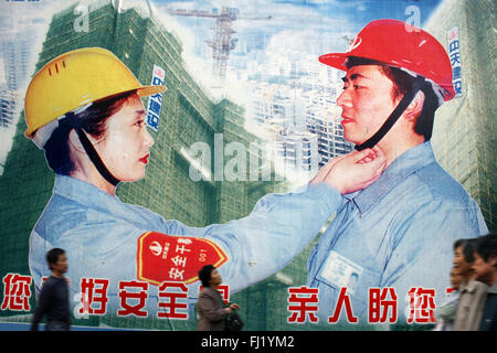Men at work and safety rules in a street of Shanghai, China Stock Photo