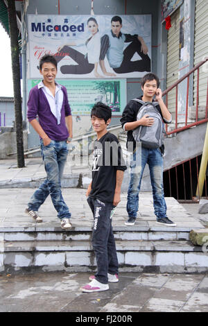 Young guys in a street of Yuanyang, Yunnan province,   China Stock Photo