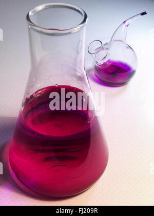 The laboratory glassware, solution of potassium permanganate Stock Photo