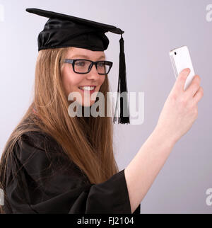 University student taking a selfie picture on her phone Stock Photo