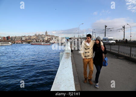 Couple walk on Galata bridge , Istanbul Stock Photo