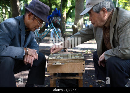 Two men are playing chess in the Hiroshima Peace Memorial Park Stock Photo