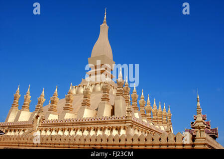 Stunning architecture of Wat Pha That Luang temple pagoda , Vientiane , Laos Stock Photo