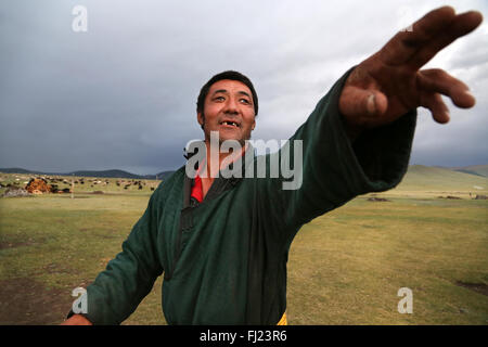 Portrait of Mongolian man with traditional dress clothes called 'deel' Stock Photo