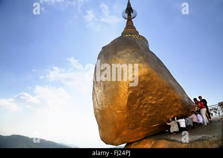 Buddhist Burmese people praying at Kyaiktiyo Pagoda Golden Rock, Myanmar Stock Photo