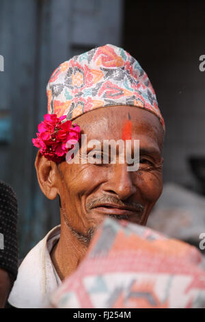 Portrait of Nepalese Newar man with tilak and traditional hat Dhaka topi in Patan Stock Photo