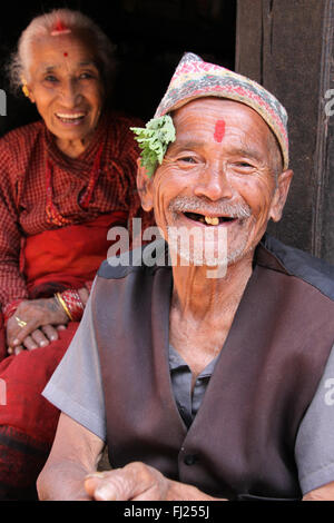 Portrait of old Nepali Newar couple, man wearing traditional hat,  Dhaka topi Stock Photo