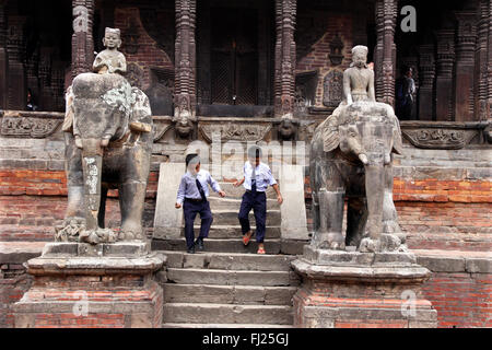 Children play at temple in Bhaktapur, Nepal Stock Photo