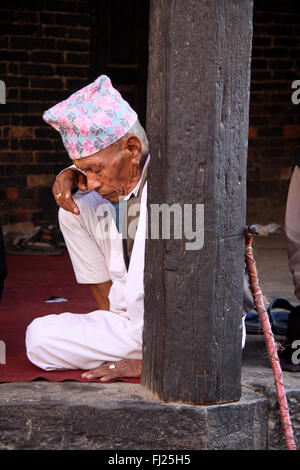 Portrait of Nepali Newar man with traditional hat Dhaka topi Stock ...