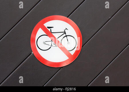 No Cycling Sign on a wooden Doorway Stock Photo