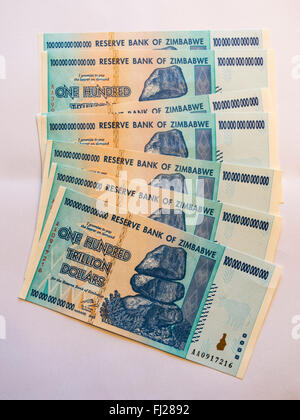 Bunch of one hundred trillion dollars banknotes issued in Zimbabwe in 2008, on the climax of the hyperinflation. Stock Photo