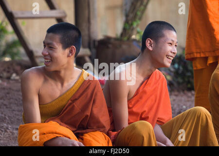 Hinayana Buddhist monks at Wat Pa Huak in the former French Provincial town of LUANG PROBANG - LAOS Stock Photo