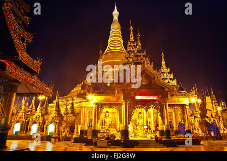 The main ZEDI of the SHWEDAGON PAYA or PAGODA which dates from 1485 is gilded every year - YANGON, MYANMAR Stock Photo