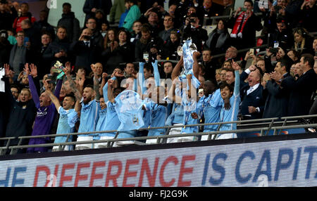 London, UK. 28th Feb, 2016. Manchester City players celebrate after winning the League Cup final between Liverpool and Manchester City at Wembley Stadium in London, Britain on Feb. 28, 2016. Manchester City claimed the title. Credit:  Han Yan/Xinhua/Alamy Live News Stock Photo