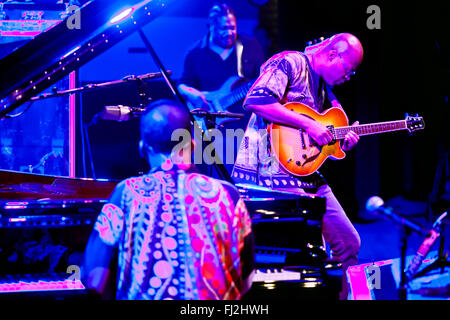 LIONEL LOUEKE plays guitar for Herbie Hancock on the main stage of the MONTEREY JAZZ FESTIVAL Stock Photo