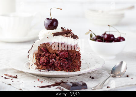 Black forest cake ,decorated with whipped cream and cherries Schwarzwald pie, dark chocolate and cherry dessert Stock Photo