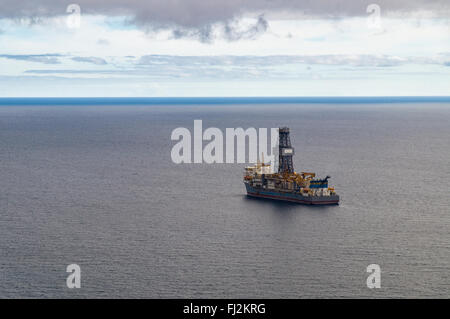 Exploratory offshore drilling by drillship, from above view Stock Photo