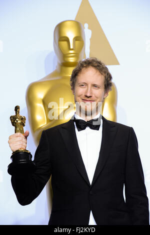 Los Angeles, USA. 28th Feb, 2016. Director Laszlo Nemes of 'Son Of Saul' (Hungary) poses after winning the best foreign language film award during the 88th Academy Awards at the Dolby Theater in Los Angeles, the United States, on Feb. 28, 2016 Credit: © Yang Lei/Xinhua/Alamy Live News  Stock Photo
