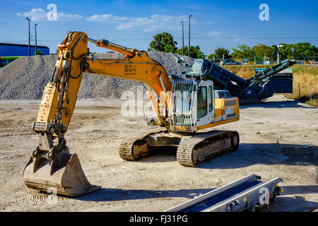 Excavator and mechanical equipment on building site, France, Europe Stock Photo