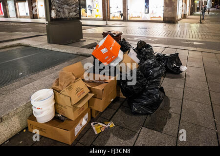 Rubbish awaiting collection on pavement at night, Strasbourg, Alsace, France Europe Stock Photo