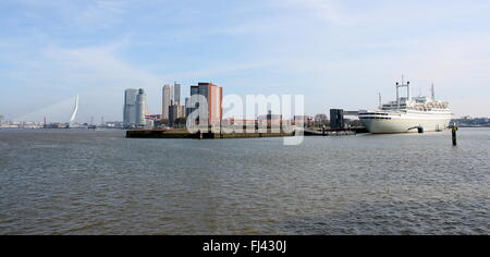 Skyline Panorama of Rotterdam, Netherlands. Erasmus Bridge, Nieuwe Maas, Kop van Zuid, Katendrecht, and Hotel Ship SS Rotterdam. Stock Photo