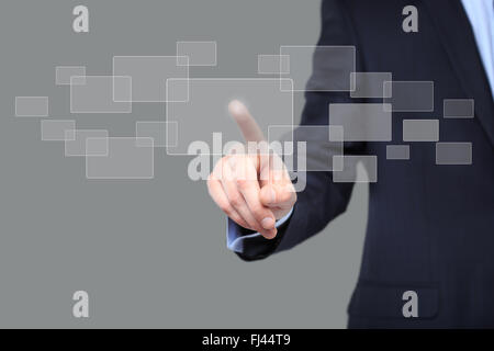 hand pushing on a touch screen interface Stock Photo