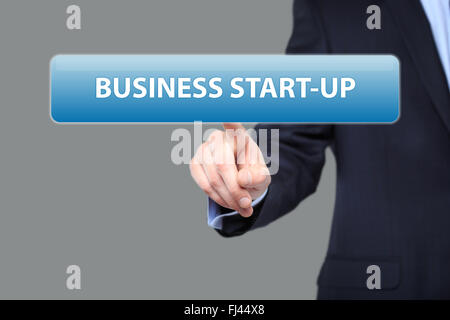business, technology and networking concept - businessman pressing business start-up button on virtual screens Stock Photo