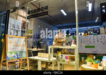 Beijing, China. 29th February, 2016. A man looks at products at Chaihuo Makerspace in Nanshan District of Shenzhen, south China's Guangdong Province, Jan. 30, 2015. By encouraging mass entrepreneurship and innovation, China saw a record startup boom in 2015 as a total of 4.44 million companies were established, up 21.6 percent from a year ago. More than 80 percent of the new firms were in tertiary industries. The boom came after government efforts to encourage people to open their own businesses, including easier market entry, less red tape and tax breaks. Stock Photo
