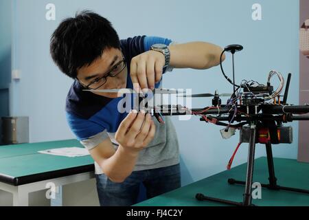 Beijing, China. 29th February, 2016. A student debugs an unmanned plane at a maker space of Donghua University in Shanghai, east China, May 14, 2015. By encouraging mass entrepreneurship and innovation, China saw a record startup boom in 2015 as a total of 4.44 million companies were established, up 21.6 percent from a year ago. More than 80 percent of the new firms were in tertiary industries. The boom came after government efforts to encourage people to open their own businesses, including easier market entry, less red tape and tax breaks. Stock Photo