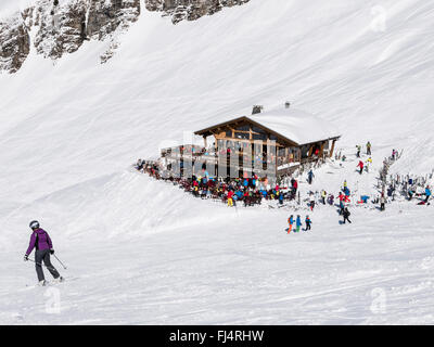 Le Blanchot Alpine ski restaurant busy with skiers on snow slopes in Le Grand Massif ski area of French Alps. Flaine, France Stock Photo