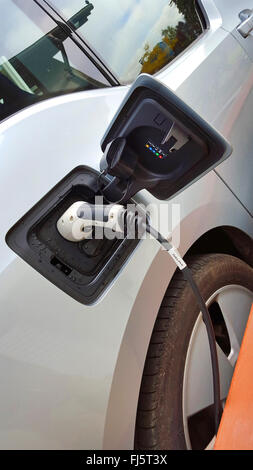 plug system at an electric car, charging Stock Photo