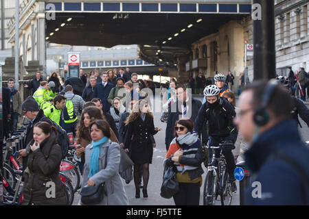 London Commuters heading into City of London after arriving at Waterloo Station, one of the main transport links to the Capital Stock Photo