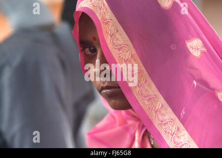 woman behind a pink veil, India, Delhi Stock Photo