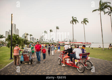 PANAMA CITY, Panama — People enjoying an evening stroll on the  waterfront boardwalk in Casco Viejo in Panama City, Panama. Stock Photo